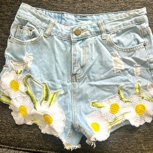 Size L but run more like a medium. Hand embroidered. Unique and beautiful.